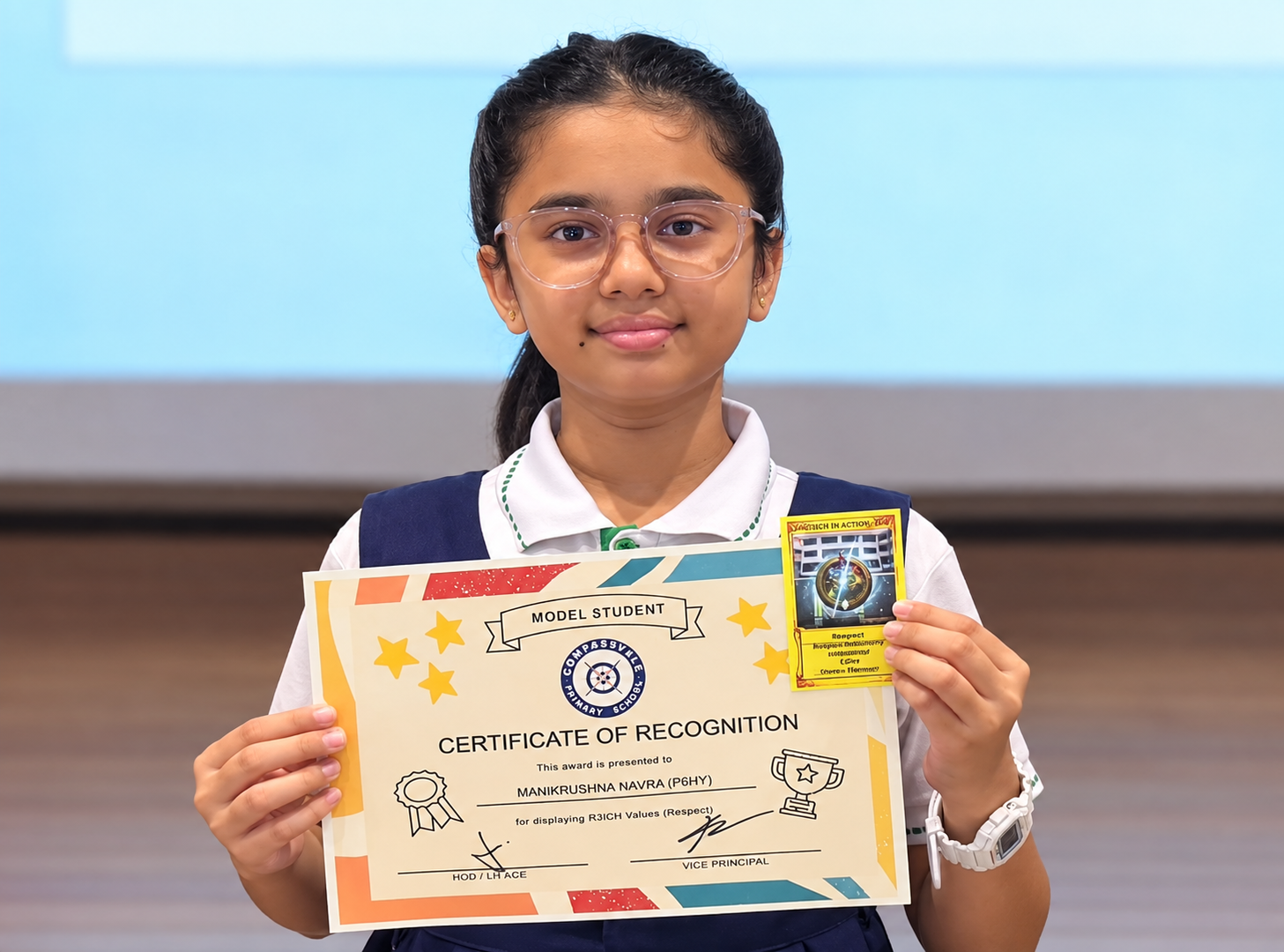 Student holding a Model Student certificate recognising her demonstration of R3ICH value Respect.